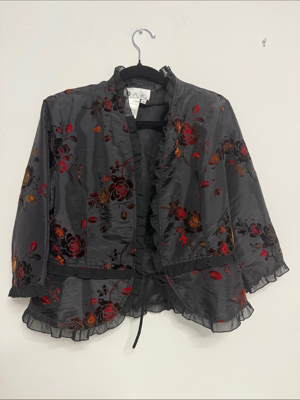 Woman’s Black Open-Front light top with Velvet accents.